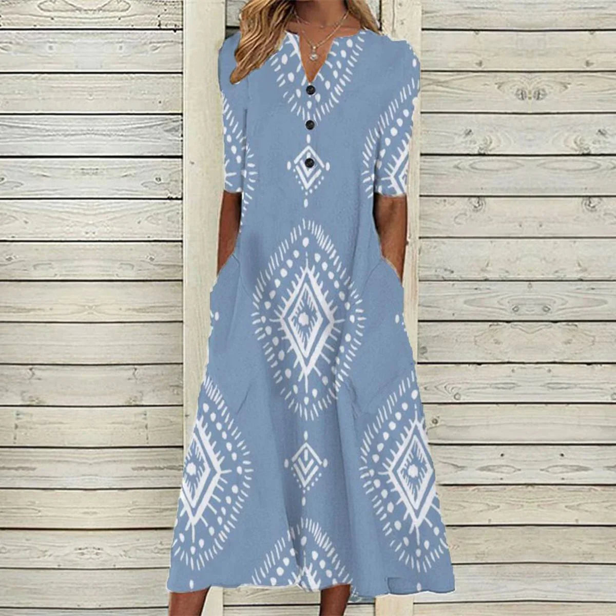 Grace – luftig blå midikjole med geometrisk print