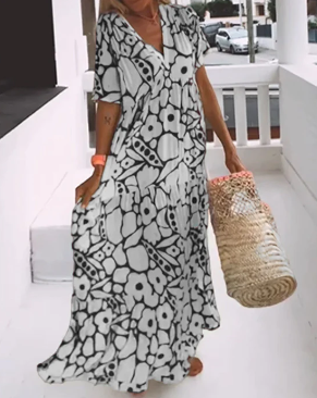 Printet bred kjole med v-udskæring