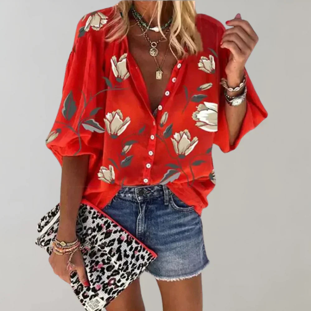 Afslappet damebluse med blomstermønster og knapper