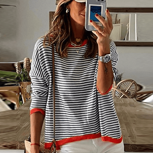 Inès Lavigne - blåstribet sweater med orange kant