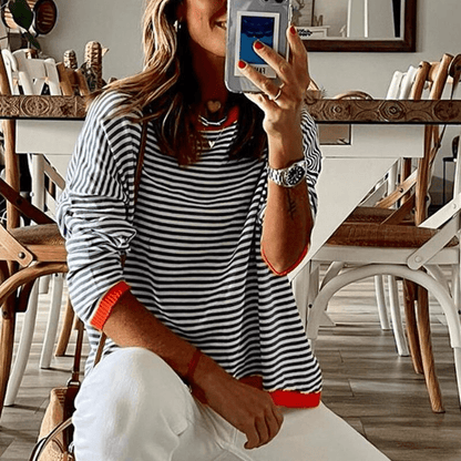 Inès Lavigne - blåstribet sweater med orange kant